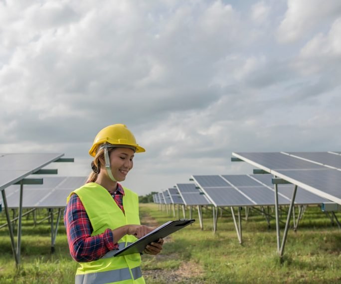 engineer-electric-woman-checking-maintenance-solar-cells_1150-4264